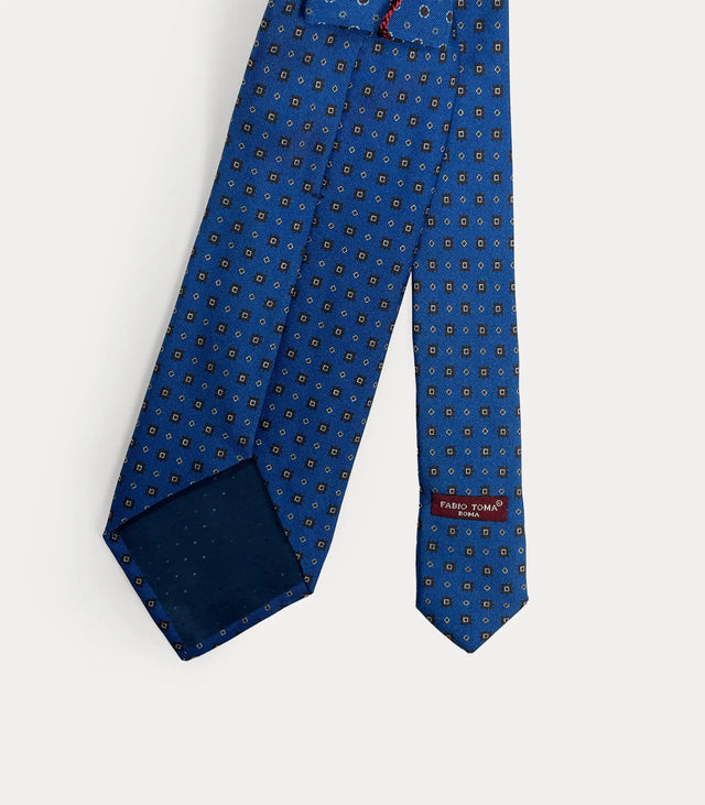 Dettaglio pattern cerchi marroni cravatta blu seta Made in Italy Fabio Toma Roma lunghezza 152 cm