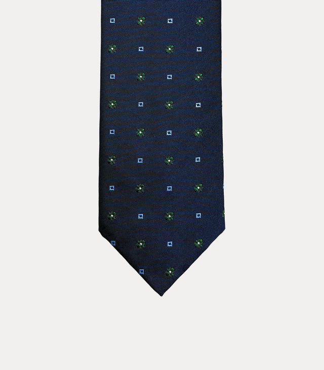 Cravatta uomo in seta 100% blu navy con microfiori verdi e dettagli geometrici azzurri Fabio Toma Roma