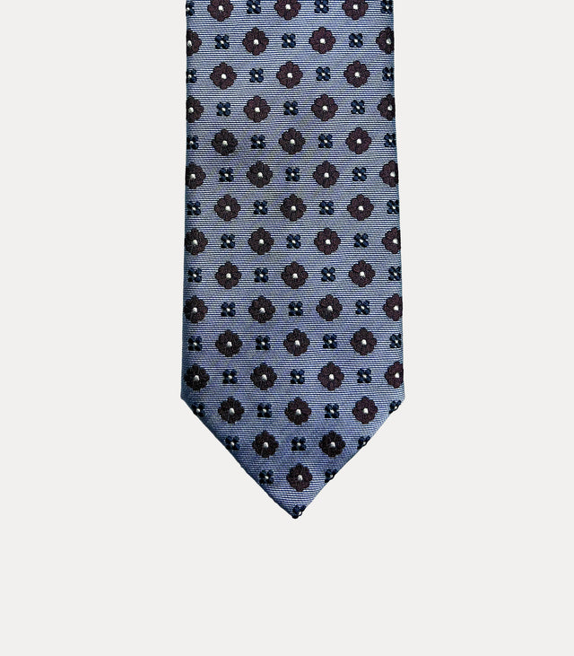 Cravatta uomo in seta 100% azzurro ghiaccio con microfiori bordeaux e blu navy Fabio Toma Roma.
