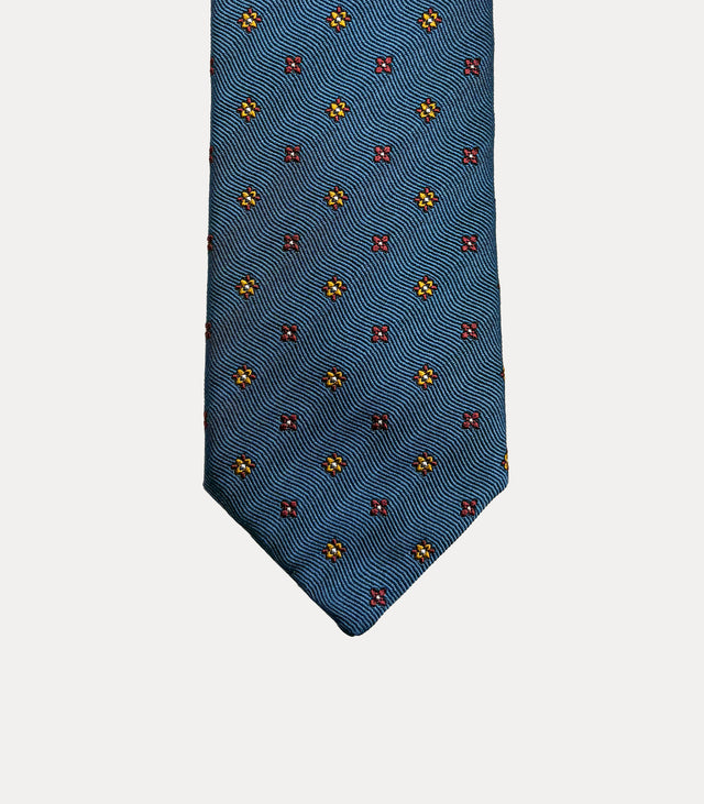 Cravatta uomo in seta 100% blu petrolio con microfiori giallo ocra e bordeaux Fabio Toma Roma.