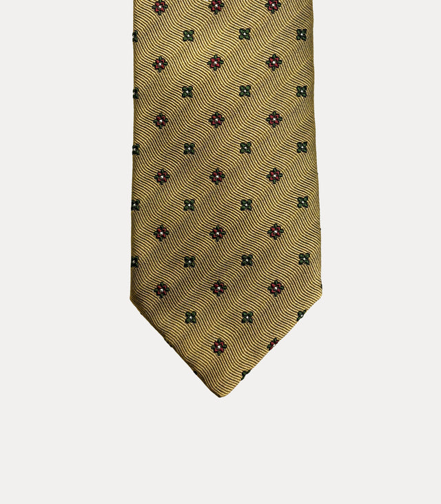 Cravatta uomo in seta 100% ocra dorato con microfantasia floreale verde bosco e bordeaux Fabio Toma Roma.