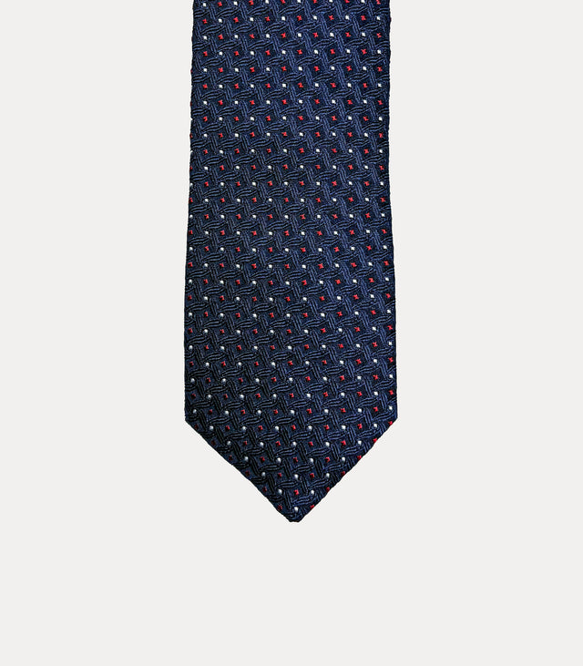 Cravatta uomo slim in seta 100% blu navy con microfantasia geometrica rossa e bianca, larghezza 6 cm Fabio Toma Roma.