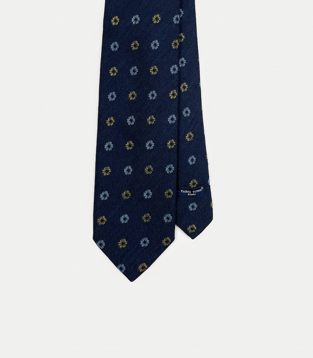 Cravatta blu navy con micro fiori gialli e celesti in lana e seta