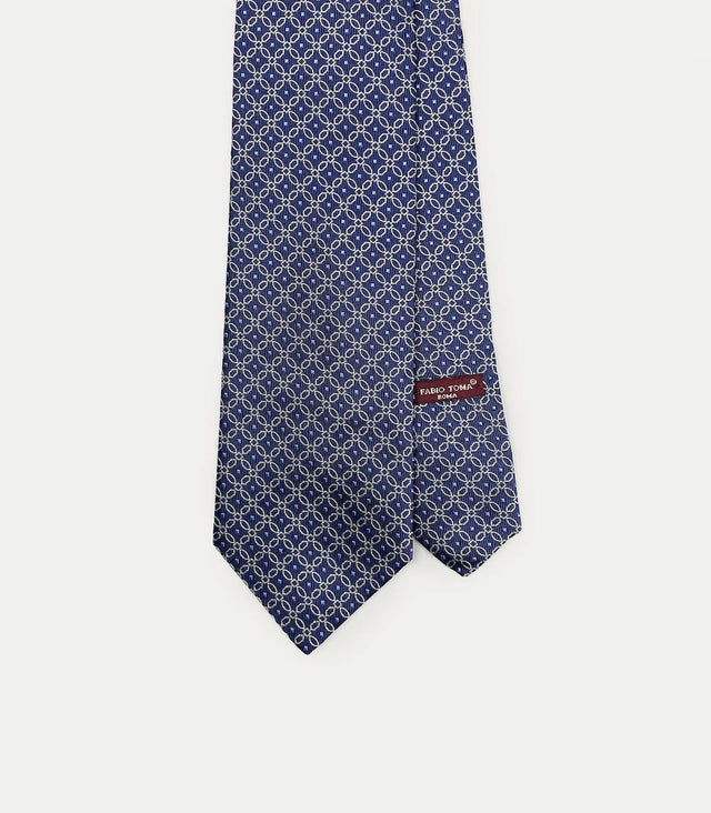 Cravatta blu in seta con motivo floreale geometrico