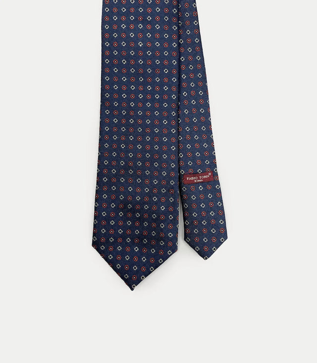 Cravatta blu in seta con motivi rossi e beige