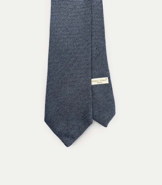 Cravatta blu in cashmere con microdisegno tono su tono