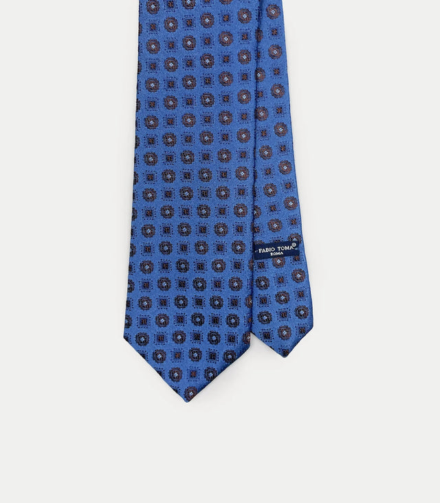 Cravatta in seta blu con motivo a quadrati marroni e blu