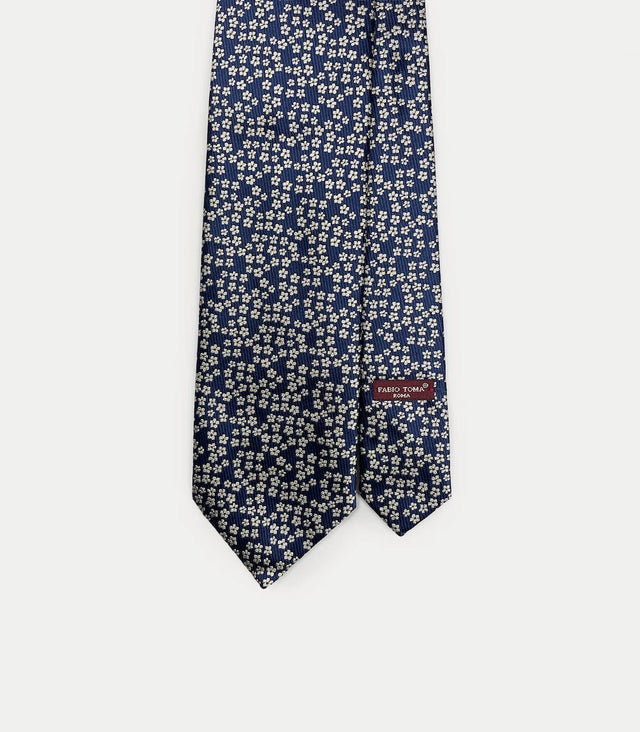 Cravatta blu navy in seta jacquard con microdisegno floreale