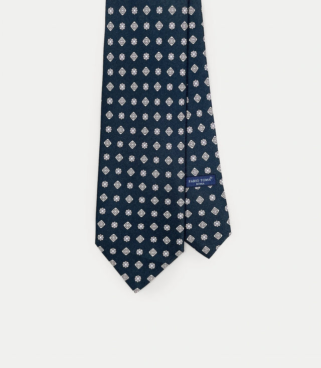 Cravatta blu notte in seta con motivo geometrico bianco