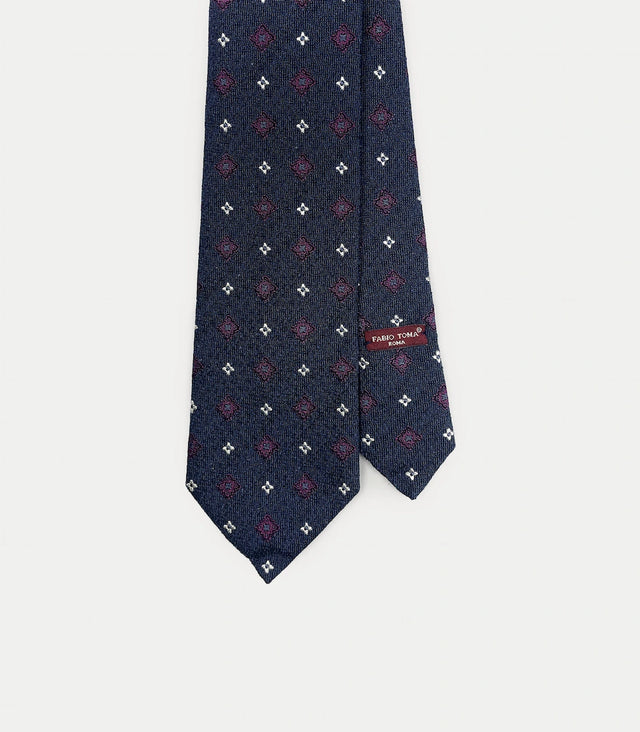Cravatta blu scuro in seta e cotone con motivo geometrico e floreale