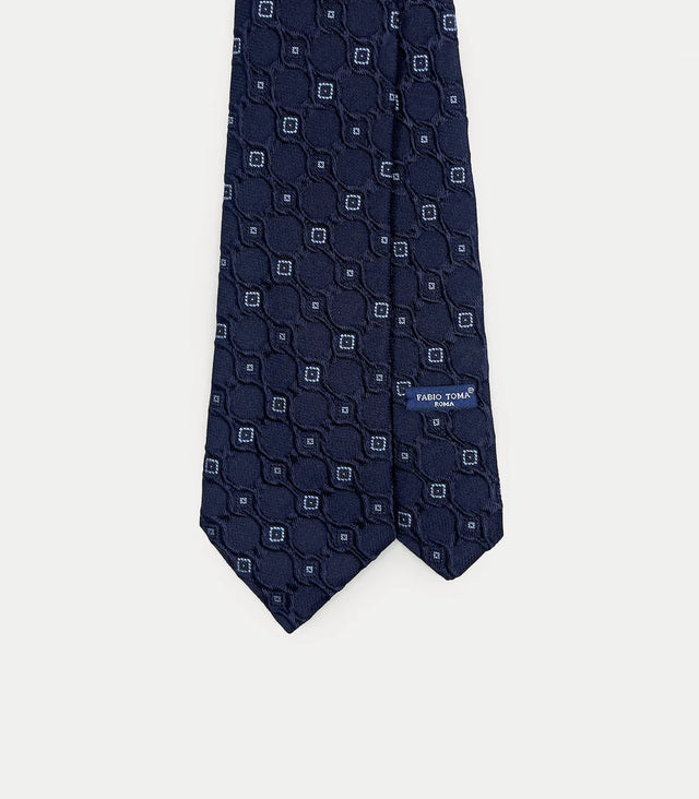 Cravatta blu scuro in seta con motivo geometrico a rilievo
