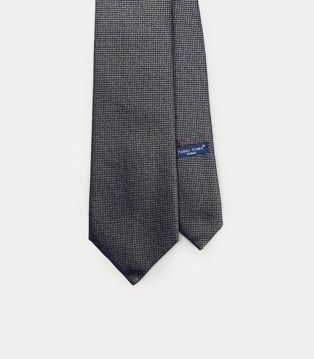 Cravatta blu scuro in seta con microfantasia beige