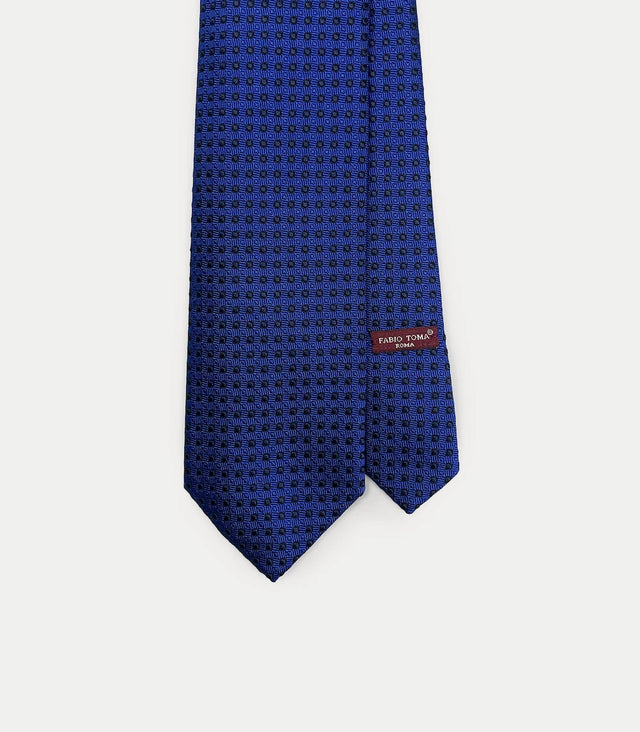 Cravatta blu in seta jacquard con motivo a spirale geometrica