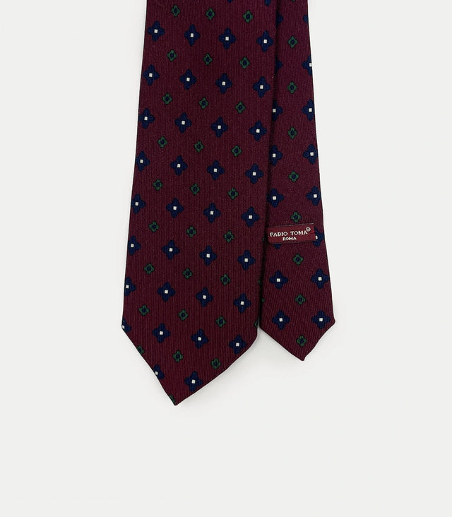 Cravatta bordeaux in lana con motivo floreale geometrico