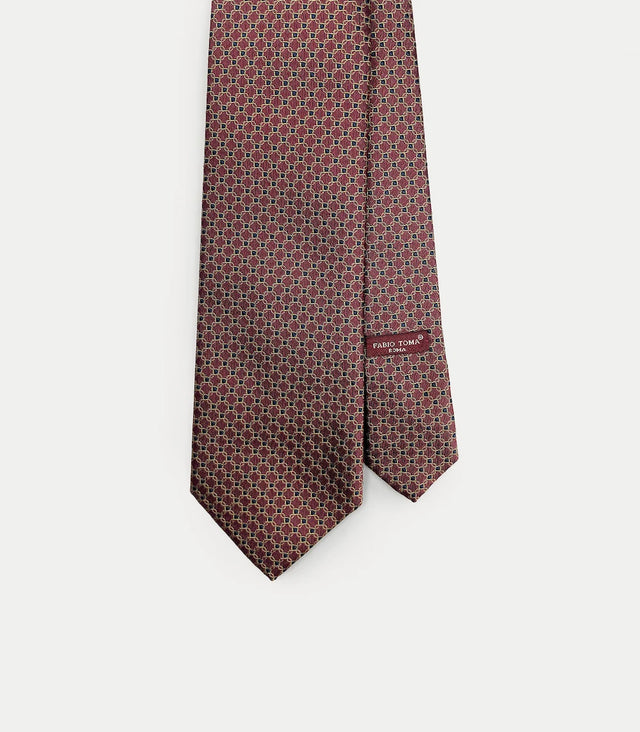Cravatta bordeaux in seta con motivo geometrico blu e giallo