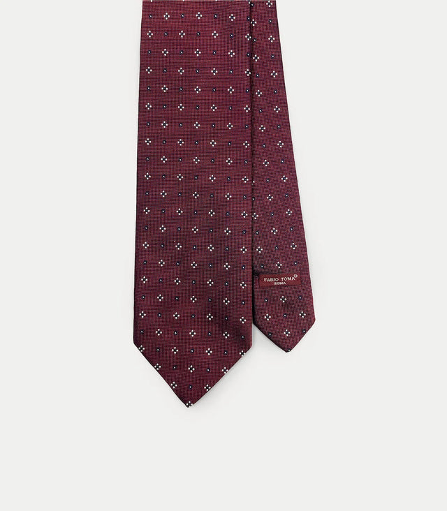 Cravatta bordeaux in seta con microfantasia bianca e blu