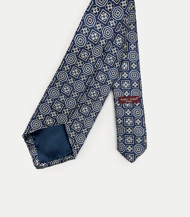 Retro cravatta blu in seta con disegno geometrico bianco