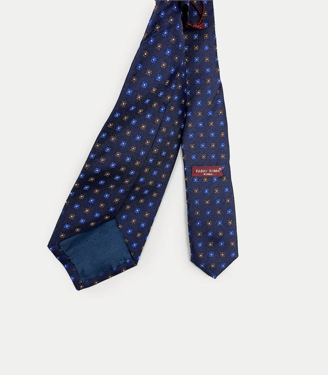 Retro cravatta blu in seta con disegni geometrici marroni e azzurri