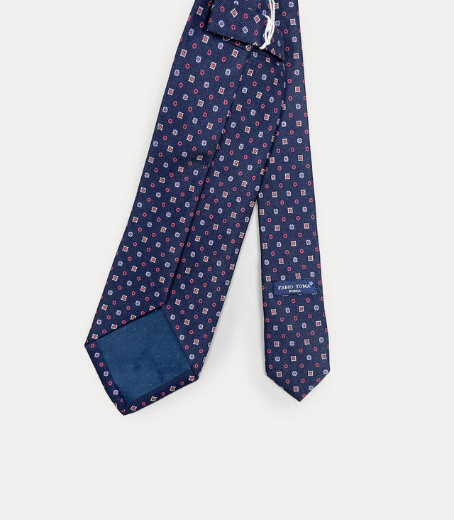 Retro cravatta blu notte in seta con fantasia micro floreale e geometrica