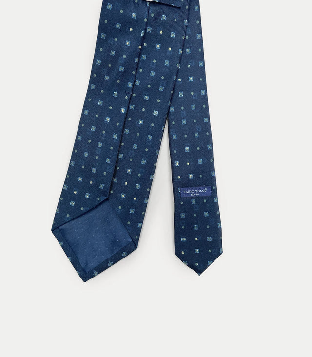 Retro cravatta blu scuro in seta con pattern geometrico