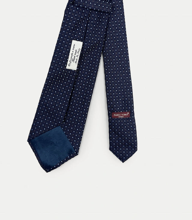 Retro cravatta blu scuro in seta jacquard con pattern puntinato