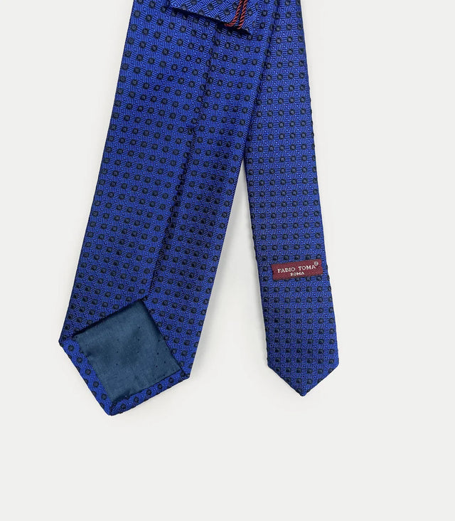 Retro cravatta blu in seta jacquard con pattern a spirale