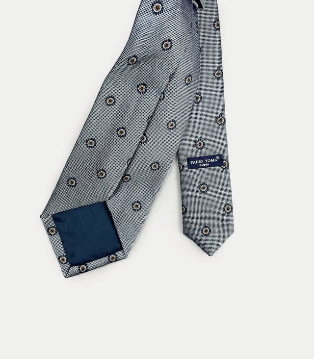 Retro cravatta azzurra con disegni geometrici floreali