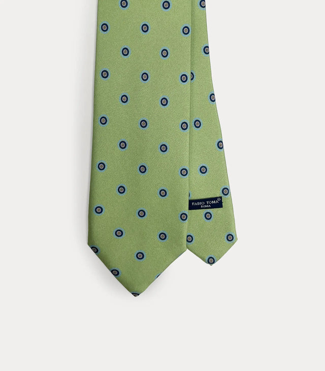 Cravatta verde salvia in pura seta con micro pattern circolare blu navy e marrone fatta a mano in Italia.
